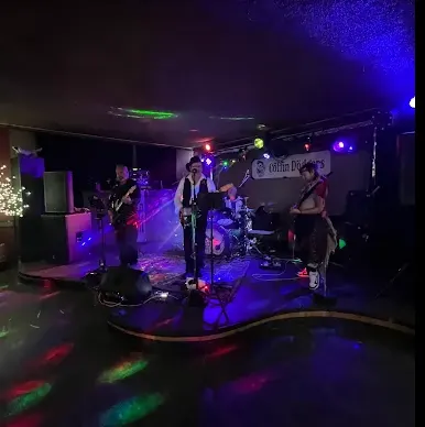A band playing live to a full room at Kicks Saloon